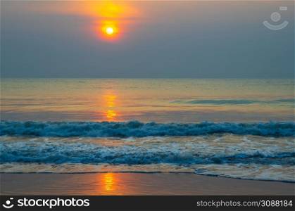 ocean beach sunrise. Beautiful beach scenery with calm waves and soft sandy beach. Empty tropical landscape, Colorful nature sea sky