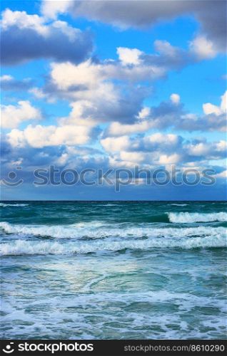 ocean coast with waves at sunrise