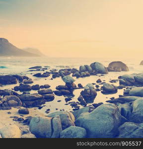 Ocean rock pools at sunset in South Africa with retro Instagram style filter effect