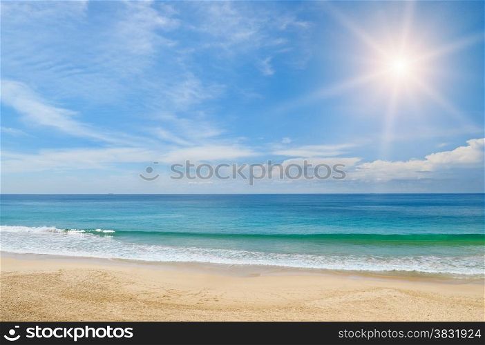 ocean, sandy beach and blue sky