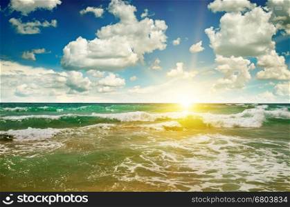 ocean, sandy beach, blue sky and sunrise