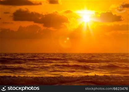 Ocean sunset at Baga beach. Goa, India. Sunset on Baga beach. Goa