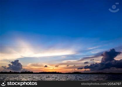 Ocean sunset. Blue sky and clouds. Beauty natural background. Ocean sunset