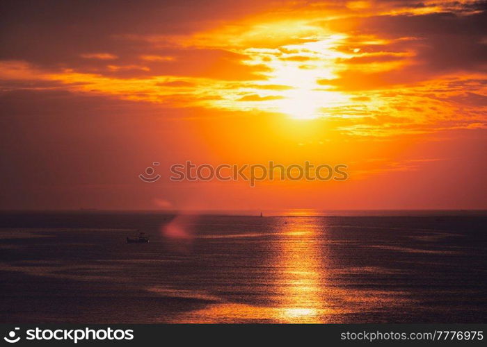 Ocean sunset with boats in sea. Mumbai, India. Sea sunset with boats