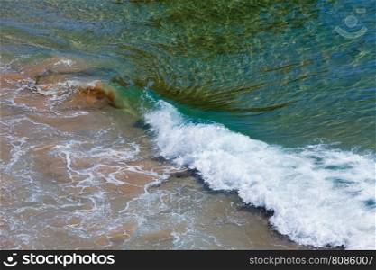 Ocean surf wave with foam. Nature background.