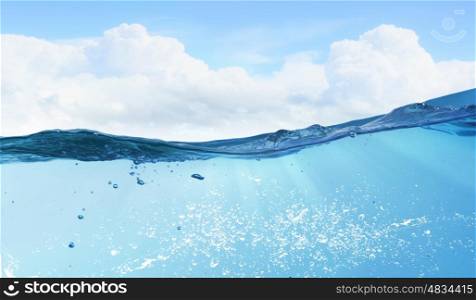 Ocean underwater view. Background image of blue sea taken under water