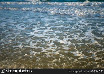Ocean wave on sandy beach