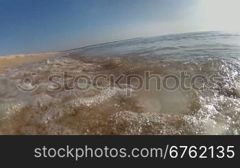 Ocean waves on tropical sand beach, moving camera pov