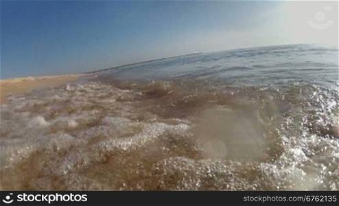 Ocean waves on tropical sand beach, moving camera pov