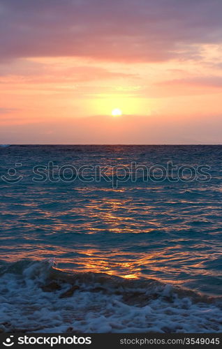 Ocean waves on tropical sunrise