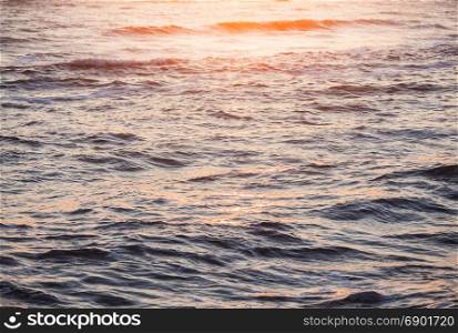 Ocean waves surface. Sunrise seascape abstract nature background