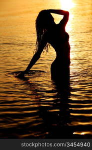 ocean woman in sunrise light