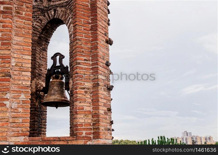 OCT 26, 2012 Barcelona, Spain - Red brick bell tower of Church of Colonia Guell or Gaudi Crypt in La Colonia Guell near Gaudi Crypt. Design by Antoni Gaudi
