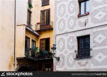 OCT 27, 2012 Bearcelona, Spain - Old Classic residential buildings on La Rambla street under warm light in afternoon.