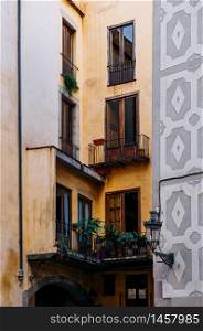 OCT 27, 2012 Bearcelona, Spain - Old Classic residential buildings on La Rambla street under warm light in afternoon.