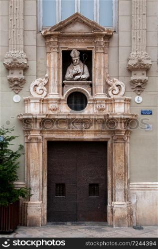 Oct 30, 2012 Valencia, Spain - Casa del Punto de Gancho carved stone statue on building facade at plaza de la Almoina near Valencia Cathedral. Architectural work of Manuel Peris Ferrando.
