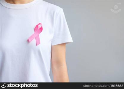 October Breast Cancer Awareness month, elderly Woman in white T- shirt with Pink Ribbon for supporting people living and illness. International Women, Mother and World cancer day concept