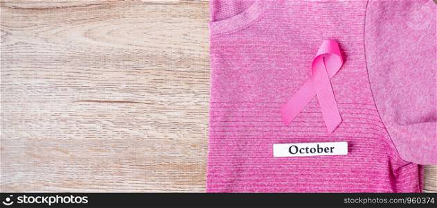 October Breast Cancer Awareness month, Pink Ribbon on pink shirt for supporting people living and illness. Healthcare, International Women day and World cancer day concept