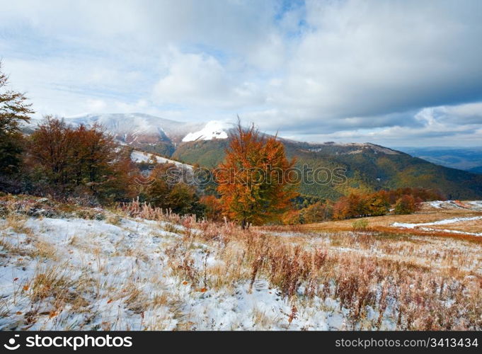 October Carpathian mountain Borghava plateau with first winter snow and autumn colorful foliage