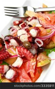 octopus salad with tomatoes, olives and red onion