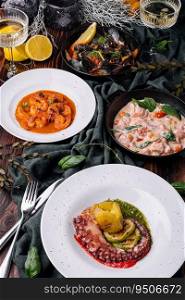 Octopus Sicilian, Salmon in cream sauce, Shrimp in Romesco sauce and Mussels