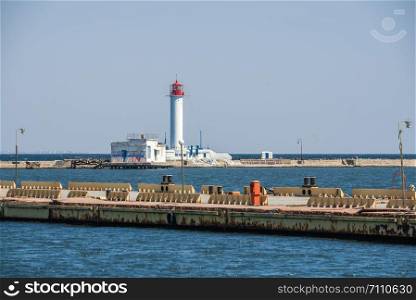 Odessa, Ukraine - 04.20.2019. Lighthouse at the entrance to the harbor of Odessa on a sunny spring day. Lighthouse at the entrance to the harbor of Odessa