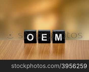 OEM or Original Equipment Manufacturer on black block with blurred background