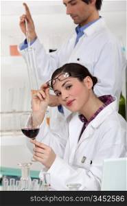 Oenologists analysing a wine