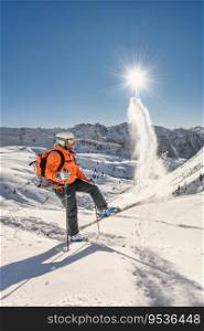 Off-piste skier lifts snow with skis after a ski