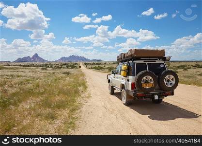 Off road vehicle on road, rear view, Swakopmund, Erongo, Namibia