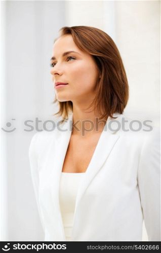 office and business concept - attractive businesswoman in office
