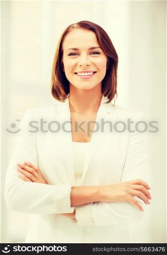 office and business concept - smiling attractive businesswoman in office