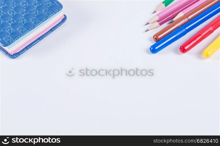 Office and school supplies on a white background. Lying on a white background with school supplies.