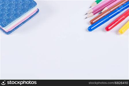 Office and school supplies on a white background. Lying on a white background with school supplies.