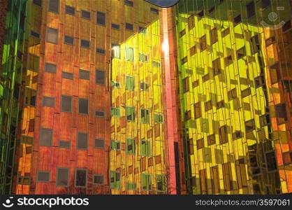 Office building with colorful reflexions in windows