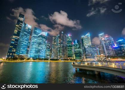 Office buildings, skyscrapers cityscape in Singapore central business district skyline, blue sky and night skyline from marina bay. Singapore cityscape.
