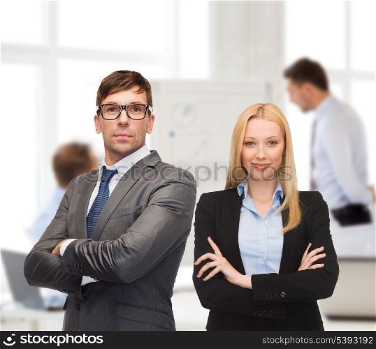 office, buisness, teamwork concept - businessman and businesswoman in the front of team