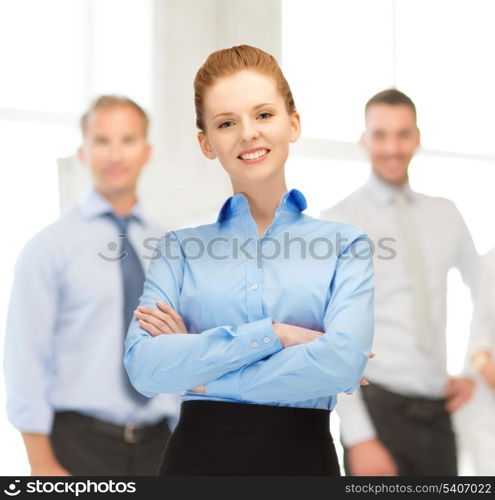 office, buisness, teamwork concept - friendly young smiling businesswoman