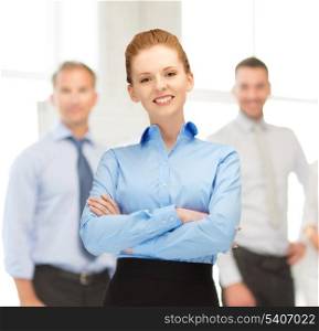 office, buisness, teamwork concept - friendly young smiling businesswoman