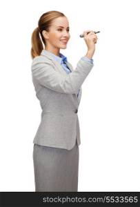 office, business and new technology concept - smiling businesswoman writing something in the air with marker