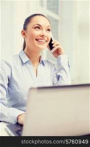 office, business and technology concept - smiling businesswoman with laptop computer and smartphone
