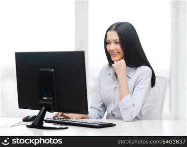 office, business, education, technology and internet concept - smiling businesswoman or student with computer