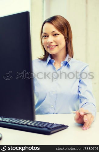 office, business, education, technology and internet concept - smiling businesswoman or student with computer