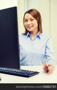 office, business, education, technology and internet concept - smiling businesswoman or student with computer