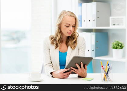 office, business, education, technology and people concept - businesswoman or student with tablet pc computer sitting at table