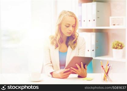 office, business, education, technology and people concept - businesswoman or student with tablet pc computer sitting at table. businesswoman or student with tablet pc at office
