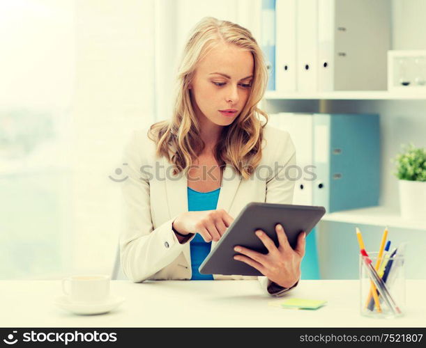 office, business, education, technology and people concept - businesswoman or student with tablet pc computer sitting at table. businesswoman or student with tablet pc at office