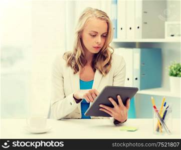 office, business, education, technology and people concept - businesswoman or student with tablet pc computer sitting at table. businesswoman or student with tablet pc at office