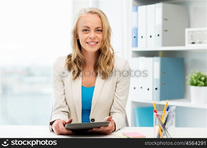 office, business, education, technology and people concept - smiling businesswoman or student with tablet pc computer sitting at table