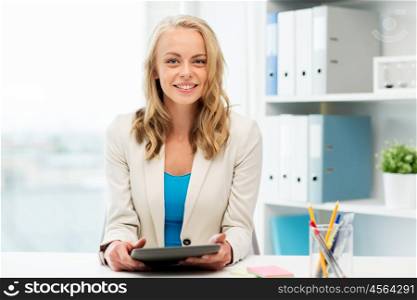 office, business, education, technology and people concept - smiling businesswoman or student with tablet pc computer sitting at table